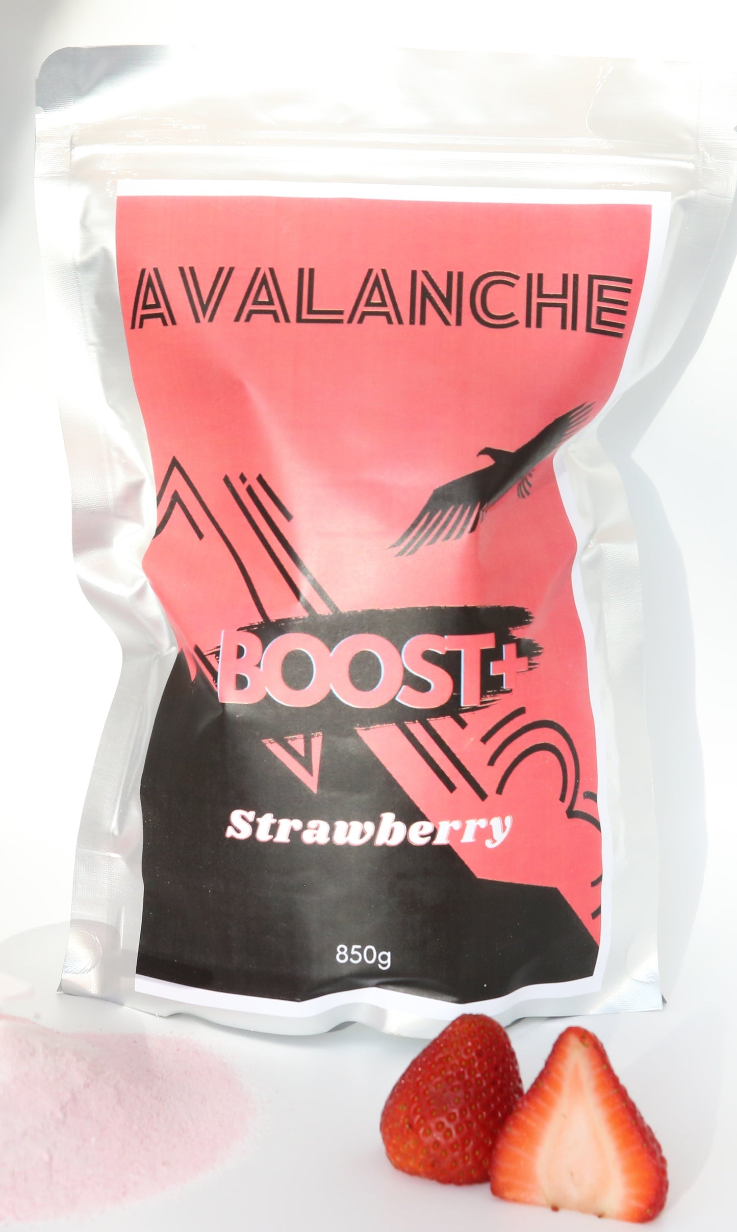 Avalanche Boost Strawberry supplement package on a white surface with two strawberries.